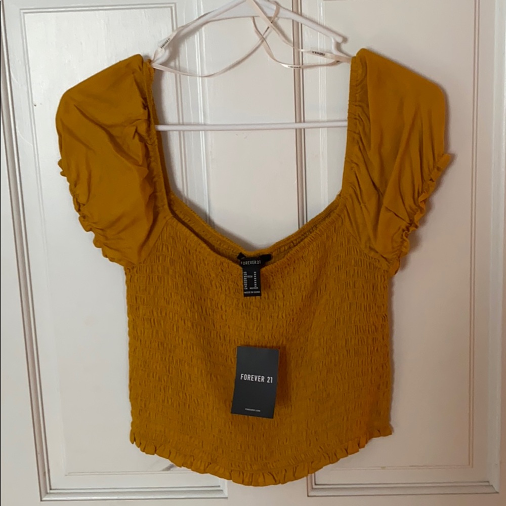 Mustard yellow top with tags. Never worn!